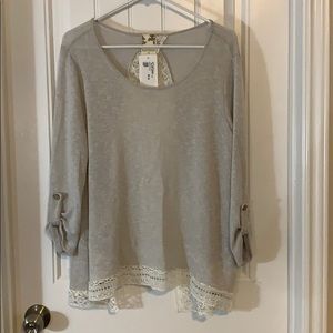 Grey open back sweater with lace detail